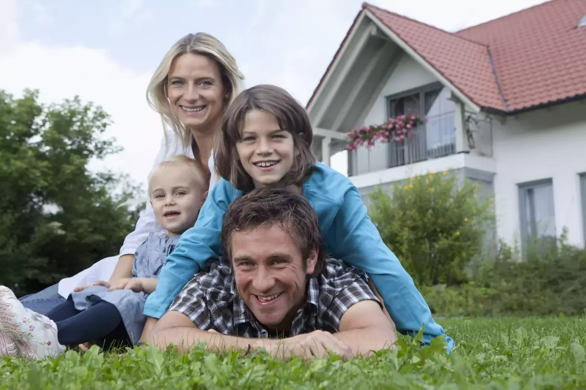 Happy family outside their pest-free home