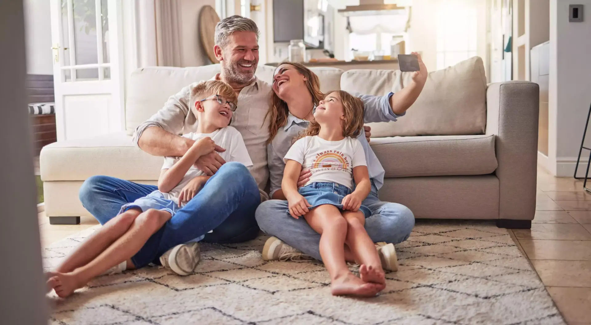 Happy family relaxing at home on the couch